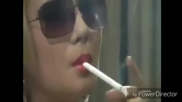 Watch These chicks love holding cigs in thier mouths warm Clips