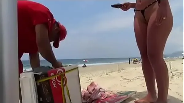 Watch showing off on the beach warm Clips